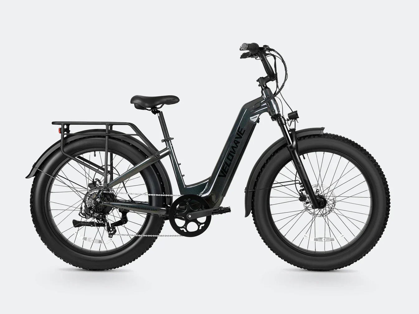 Electric bike with step thru frame and fat tire design for enhanced stability and comfort.