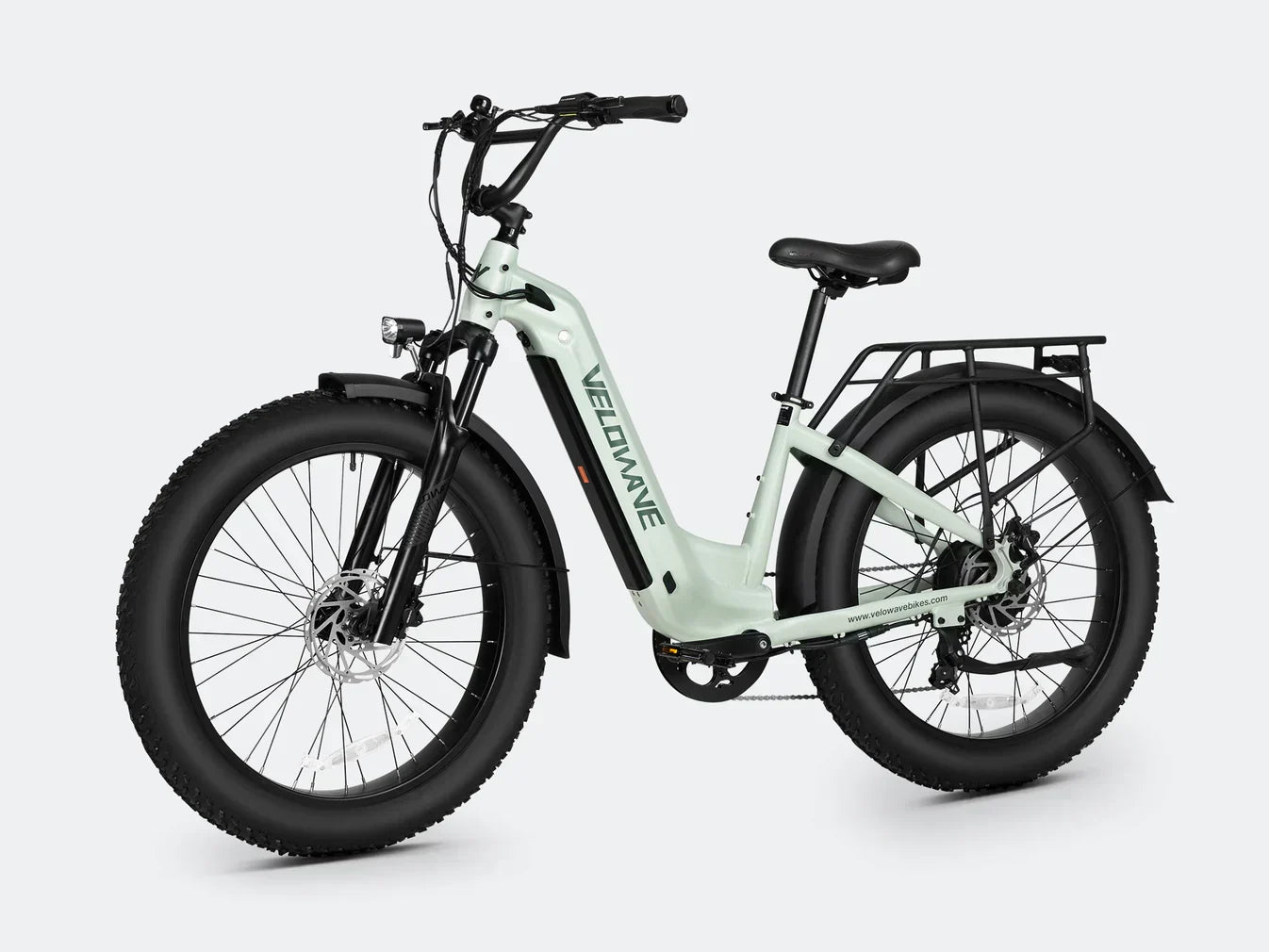 Electric bike with step thru frame and fat tire design for enhanced stability and comfort.