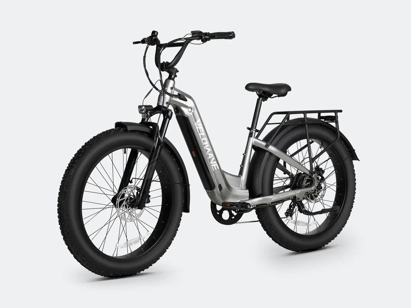 Electric bike with step thru frame and fat tire design for enhanced stability and comfort.